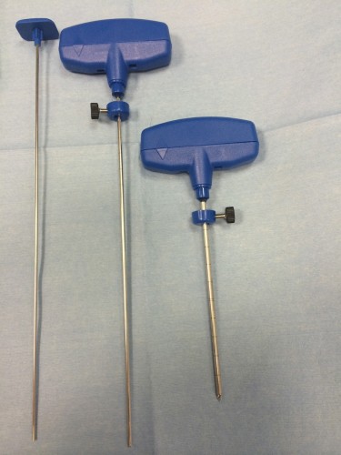 Bone biopsy hand drill (right) and biopsy needle (middle). The trochar on the left is for pushing the bone sample out of the biopsy needle, as it if often firmly stuck in the core of the needle.